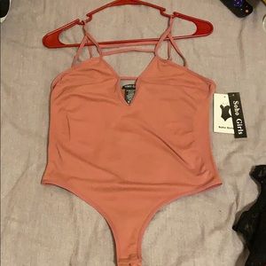 Body suit with strapped detail.